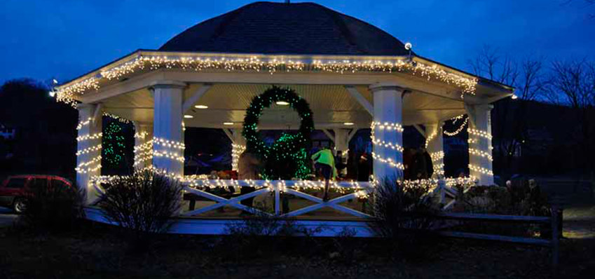The bandstand, bright for the holidays in Hawley.